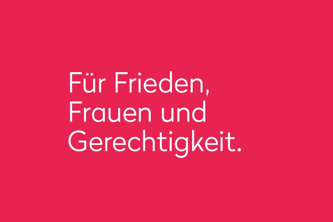 Der Claim in weissen Buchstaben von Frieda, der feministischen Friedensorganisation auf pinkem Hintergrund.